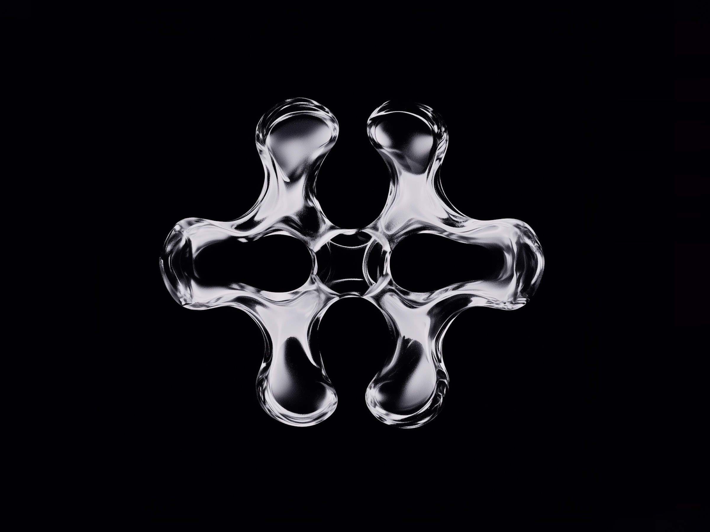 A glossy liquid-metal shape with four rounded lobes on a black background.